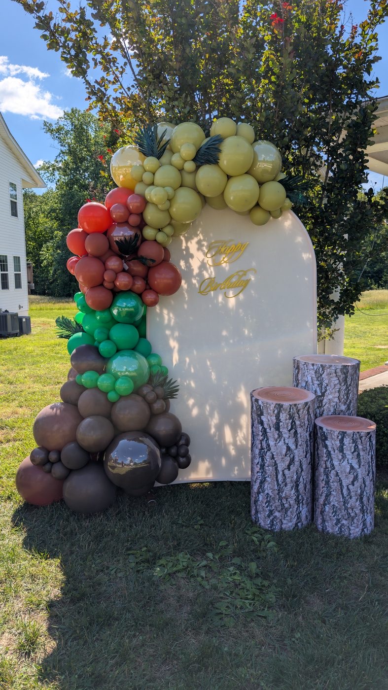Custom earth-toned birthday balloon installation
